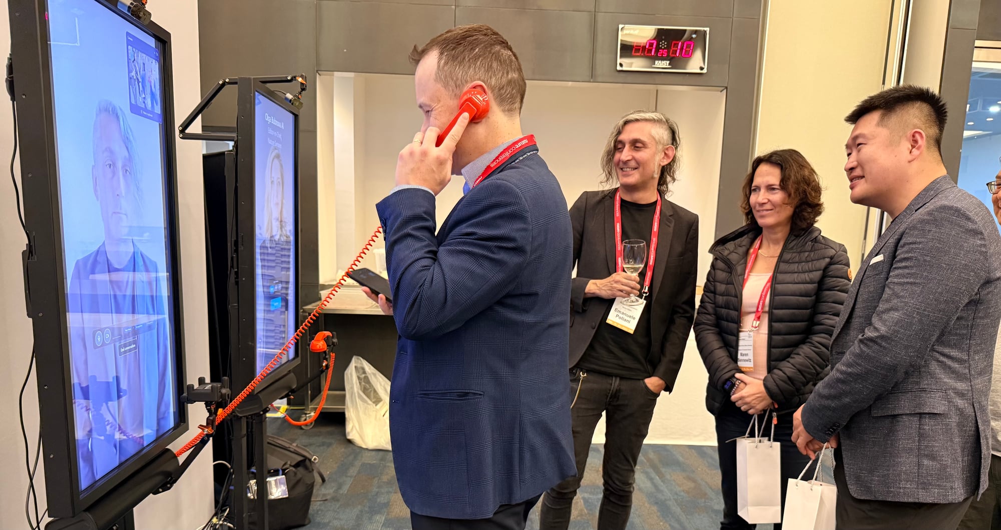 A visitor talking with an AI Symbiont while others look on