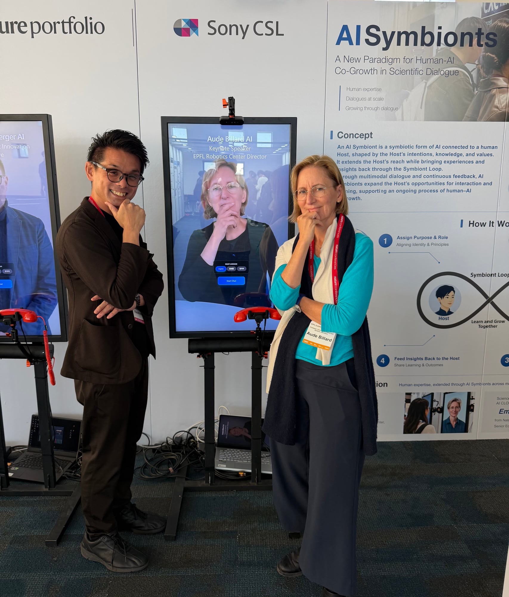Shunichi Kasahara and Aude Billard posing next to her AI Symbiont
